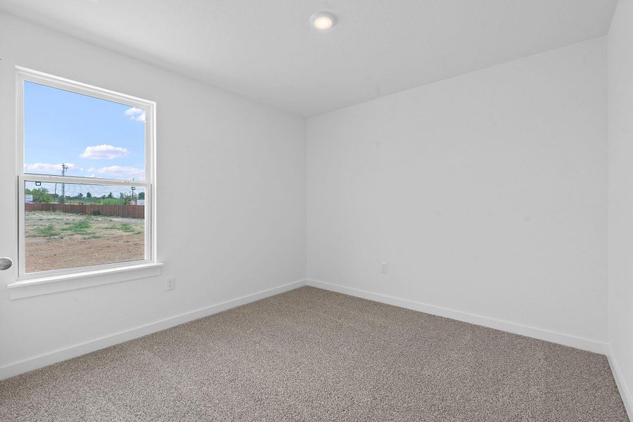 Empty room featuring carpet floors and recessed lighting Empty room featuring carpet floors and recessed lighting