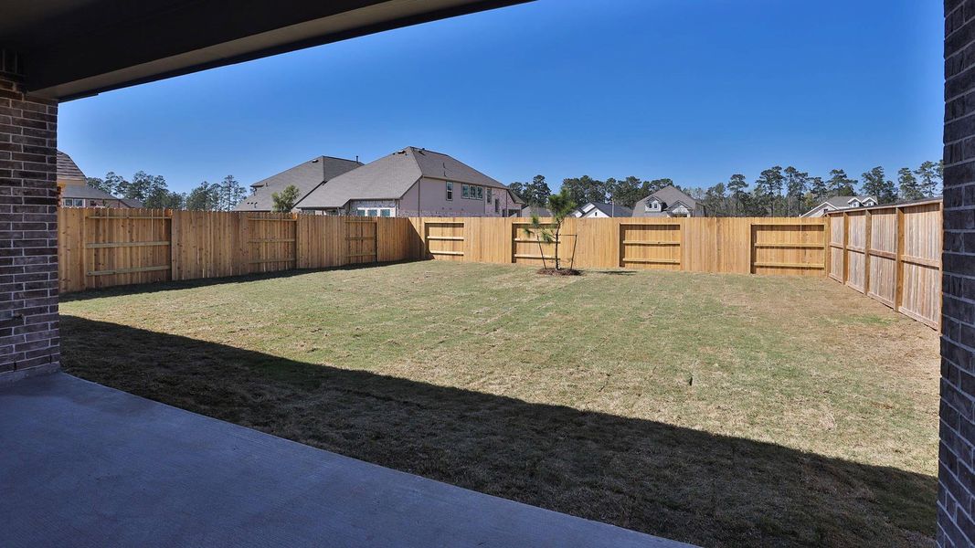 Exterior details and patio area of a home in Evergreen, Conroe (Image 2).