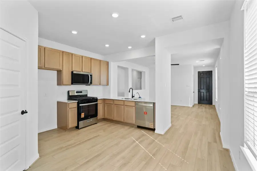 Create lasting memories with family and friends in this inviting kitchen/dining room! It showcases high ceilings, recessed lighting, custom paint, large window with blinds, and an access door to the backyard. Create lasting memories with family and friends in this inviting kitchen/dining room! It showcases high ceilings, recessed lighting, custom paint, large window with blinds, and an access door to the backyard.