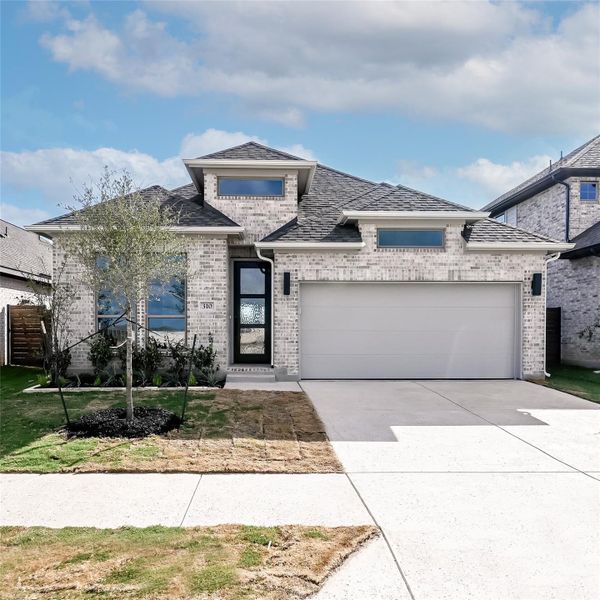 Front exterior of a new home in Juniper Springs, Lockhart, TX, highlighting curb appeal (Image 17). Front exterior of a new home in Juniper Springs, Lockhart, TX, highlighting curb appeal (Image 17).
