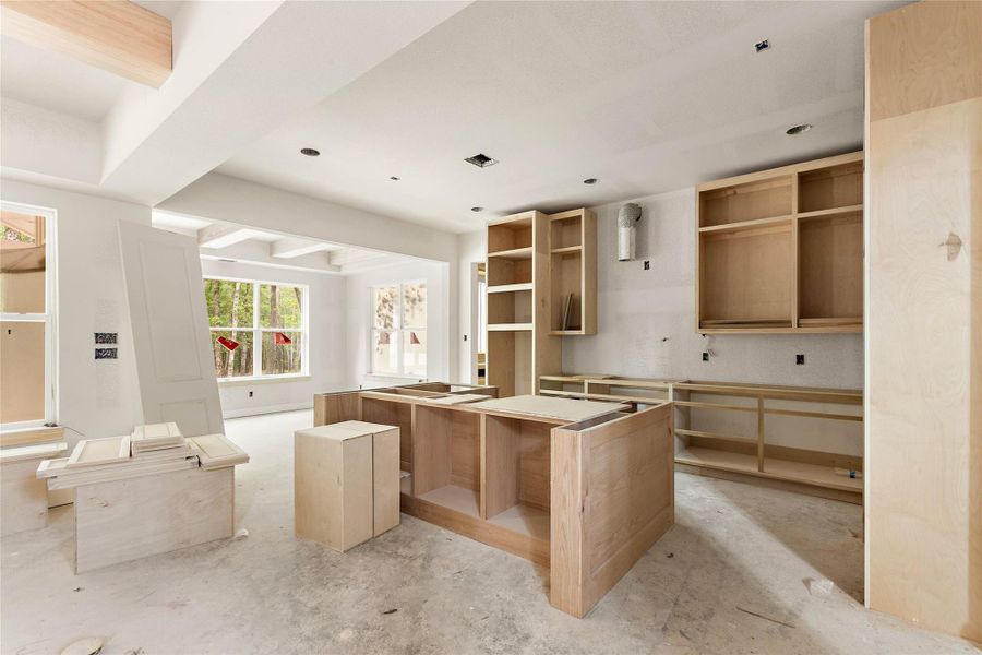 Off the island kitchen is a dining area that overlooks the beautiful backyard. Off the island kitchen is a dining area that overlooks the beautiful backyard.