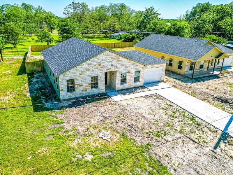 Front exterior of a new home in , Kerens, TX, highlighting curb appeal (Image 2). Front exterior of a new home in , Kerens, TX, highlighting curb appeal (Image 2).