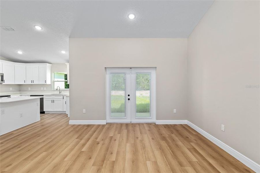 Dining area and French Doors with blinds built in.