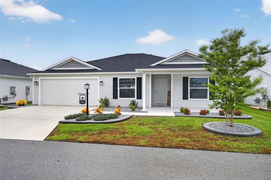 Front exterior of a new home in , The Villages, FL, highlighting curb appeal (Image 20).
