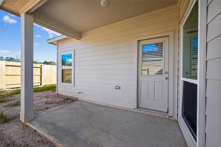 Exterior details and patio area of a home in Enclave at Willis, Willis (Image 19).