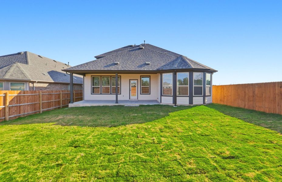 Exterior details and patio area of a home in Saddleback at Santa Rita Ranch, Liberty Hill (Image 29).