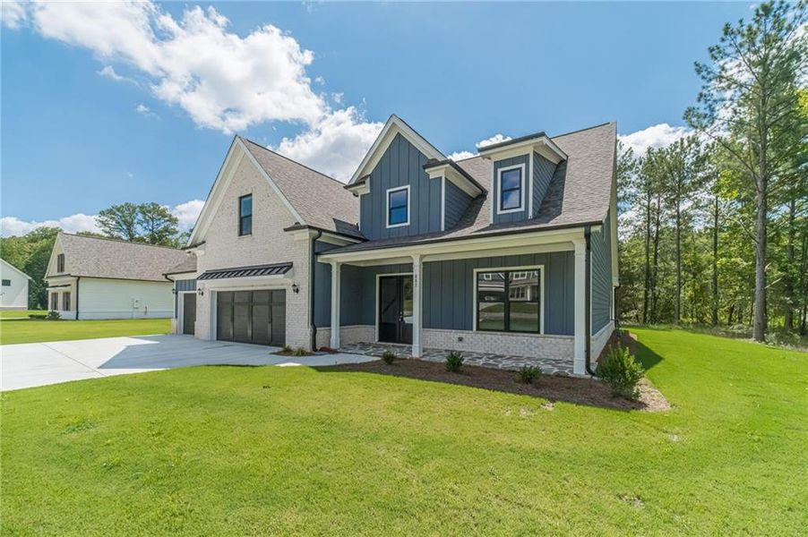 Front exterior of a new home in , Loganville, GA, highlighting curb appeal (Image 25).
