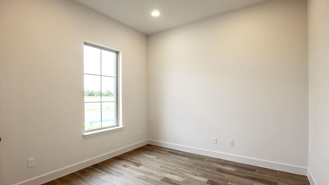 Spacious, unfurnished interior of a new home in Santa Rita Ranch - Tierra Rosa, Liberty Hill (Image 13).
