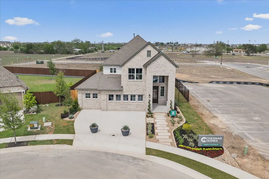 Representative exterior photo of a completed home built from the Dublin by Chesmar Homes in Legacy at Lake Dunlap, New Braunfels, TX (Image 22).