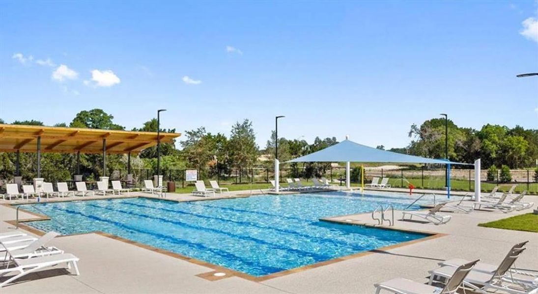 Resort-style aquatic amenity featuring a multi-lane swimming pool and an adjacent shallow water area