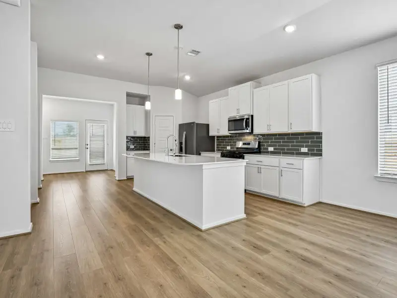 Furnished interior view inside a new home in Riviera Pines - Premier Series, Huffman (Image 4).