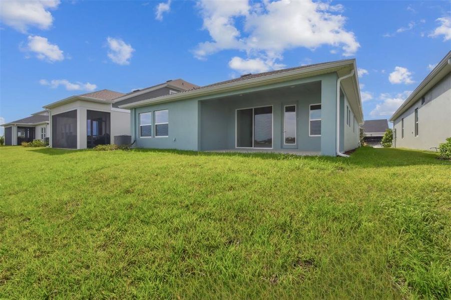 Exterior details and patio area of a home in The Peninsula at Rhodine Lake, Riverview (Image 3).