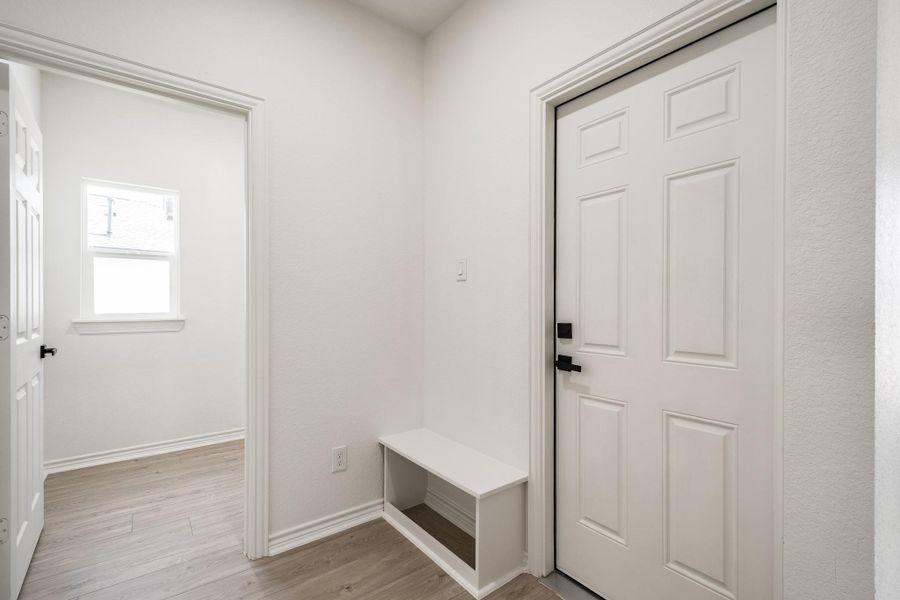 Hallway to garage and laundry room Hallway to garage and laundry room