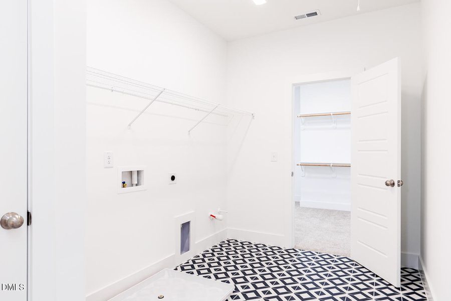 Large Laundry w/access to owner's closet
