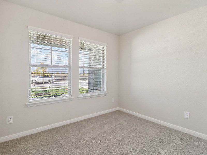 Guest bedroom in the Callaghan floorplan at a Meritage Homes community.