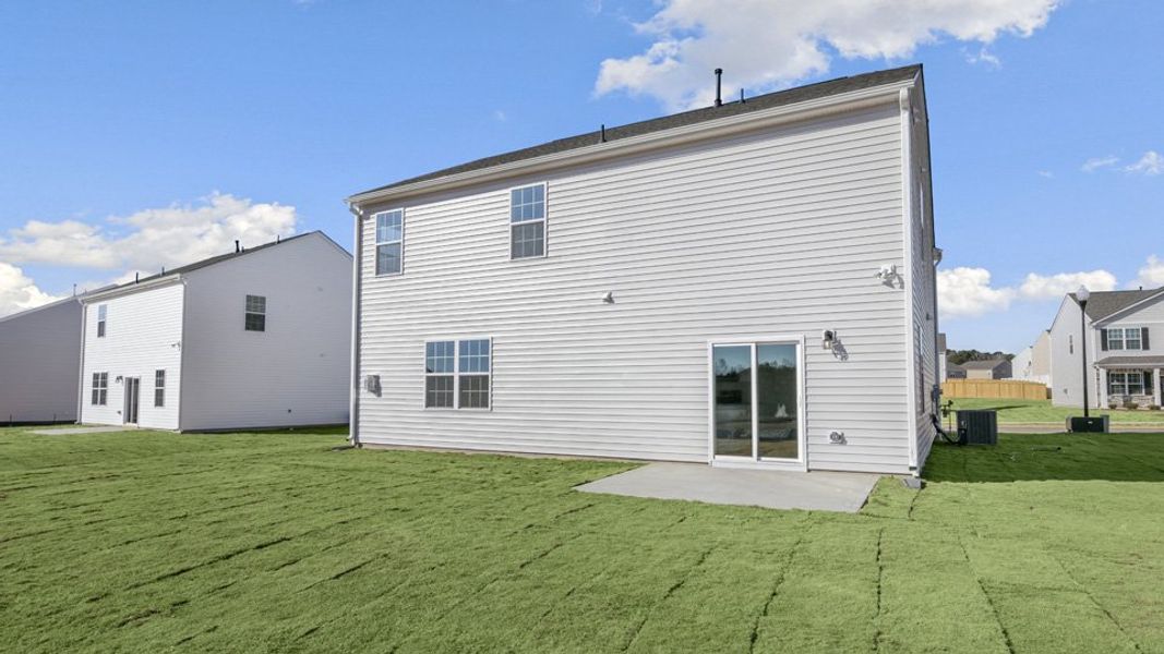 Exterior details and patio area of a home in Ridgewood Farms, Winterville (Image 20).