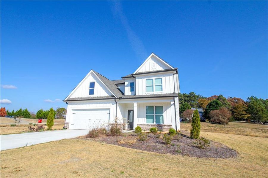 Front exterior of a new home in , Commerce, GA, highlighting curb appeal (Image 2).
