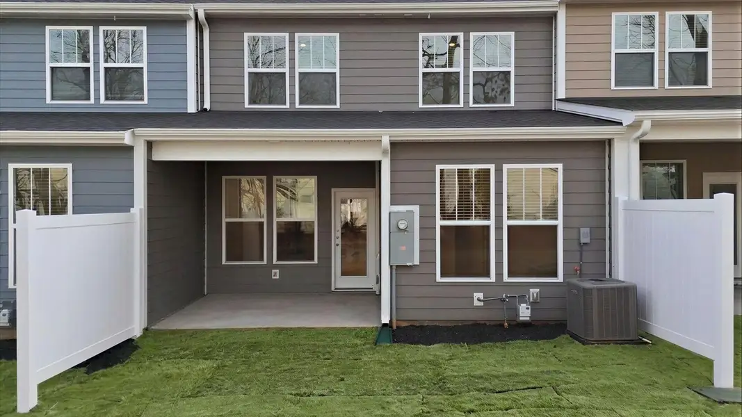 Exclusive rear covered porch with accomplished detail and elevated outdoor living potential at Pelham Crossing