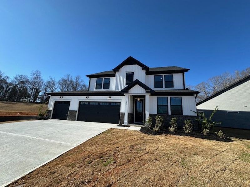 This newly constructed home features a contemporar