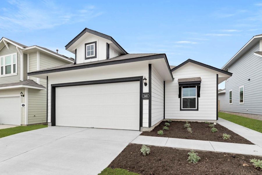 Front exterior of a new home in Hymeadow, Maxwell, TX, highlighting curb appeal (Image 17).