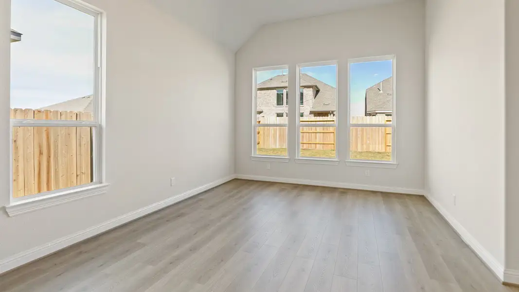 Representative furnished interior of a home built from the Yale by DRB Homes in Creekhaven, Iowa Colony (Image 10).