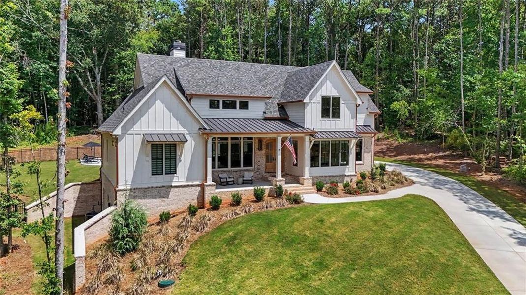 Front exterior of a new home in , Monroe, GA, highlighting curb appeal (Image 30). Front exterior of a new home in , Monroe, GA, highlighting curb appeal (Image 30).