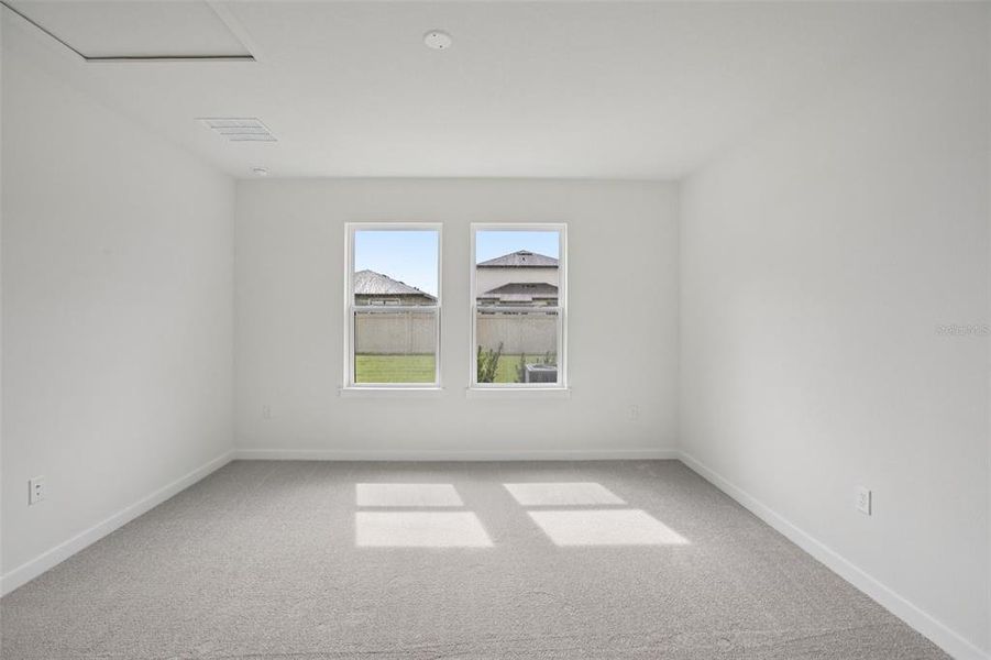 Spacious, unfurnished interior of a new home in Grasslands West, Lakeland (Image 38).