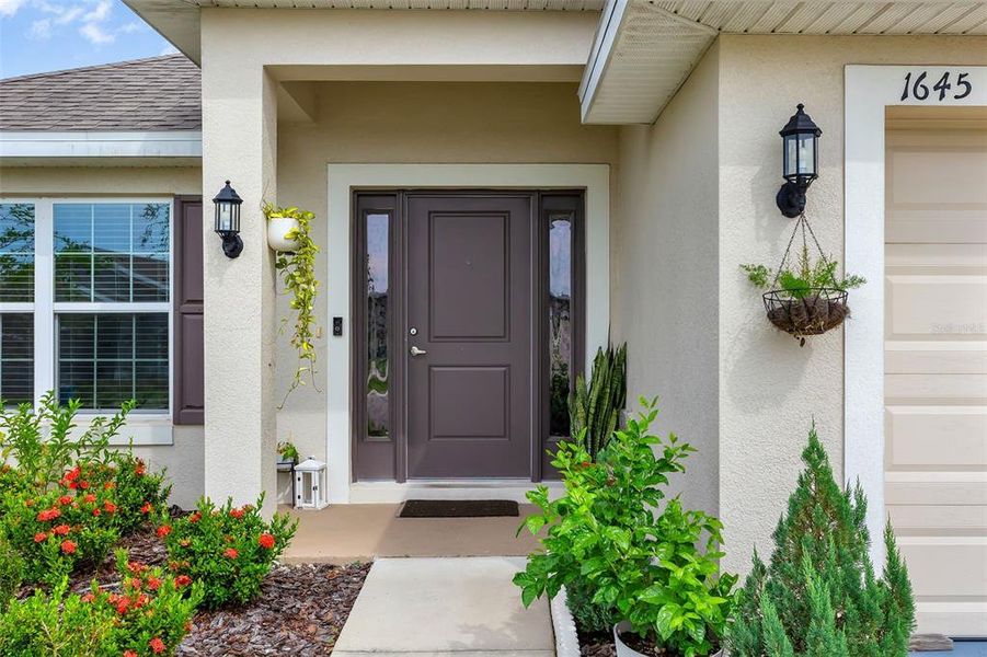 Front exterior of a new home in Citrus Landing, Davenport, FL, highlighting curb appeal (Image 23).