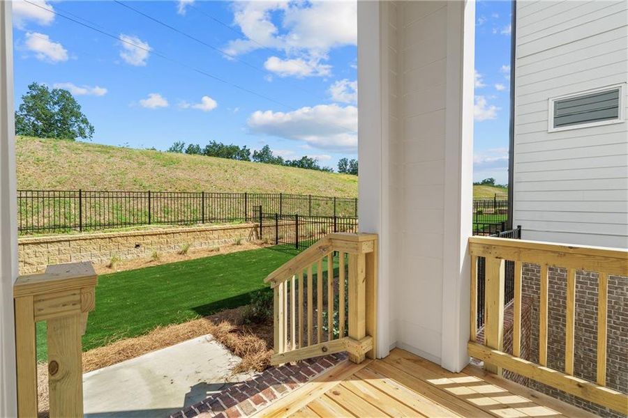 Exterior details and patio area of a home in Palisades Single Family, Cumming (Image 22).