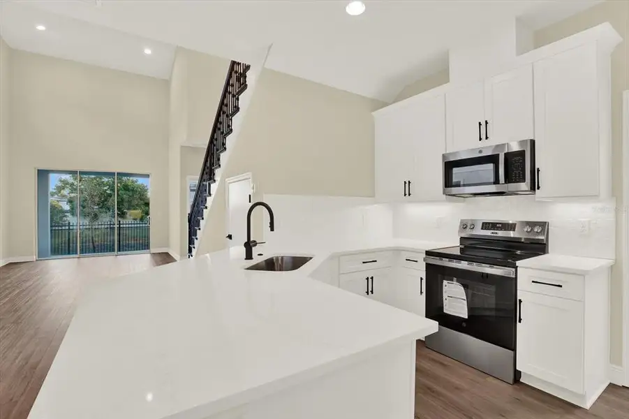 Furnished interior view inside a new home in The Towns At Long Bayou, Seminole (Image 6).