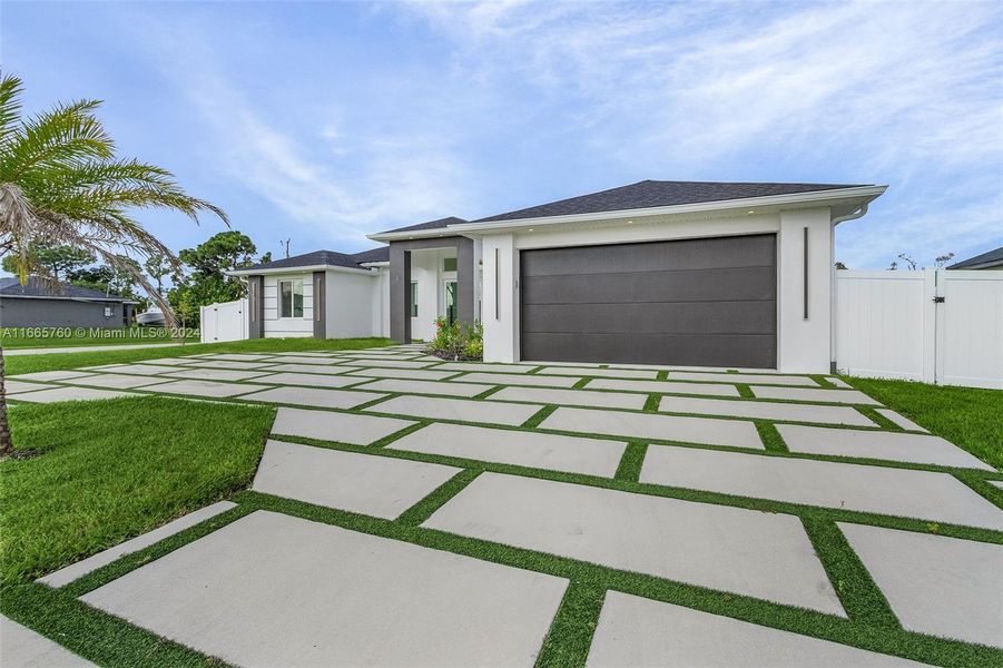 Front exterior of a new home in , Cape Coral, FL, highlighting curb appeal (Image 14). Front exterior of a new home in , Cape Coral, FL, highlighting curb appeal (Image 14).