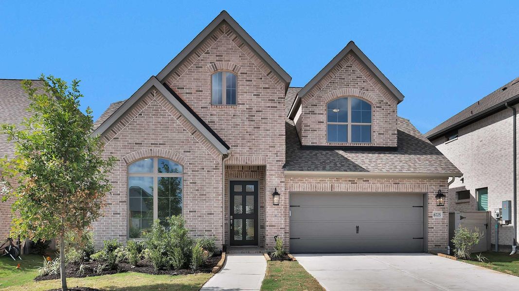 Front exterior of a new home in Legacy, League City, TX, highlighting curb appeal (Image 1). Front exterior of a new home in Legacy, League City, TX, highlighting curb appeal (Image 1).
