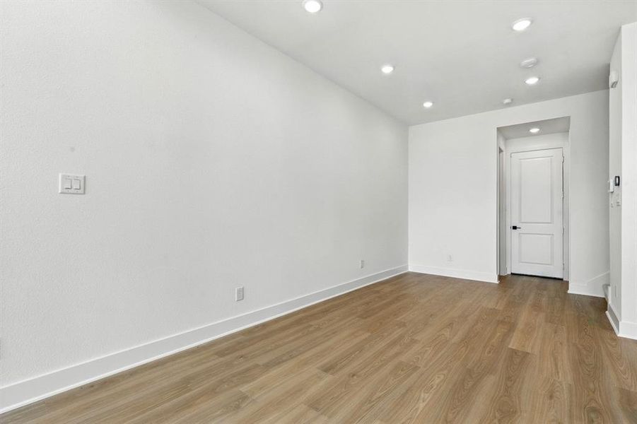 Empty room with recessed lighting and light wood-style floors Empty room with recessed lighting and light wood-style floors