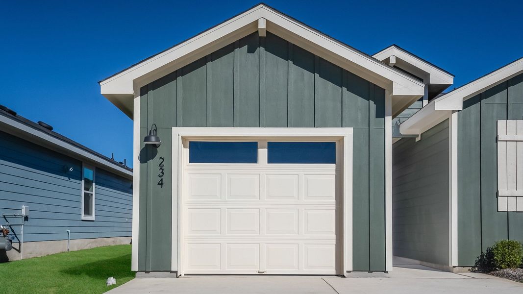 Front exterior of a new home in Marigold, Kyle, TX, highlighting curb appeal (Image 2). Front exterior of a new home in Marigold, Kyle, TX, highlighting curb appeal (Image 2).