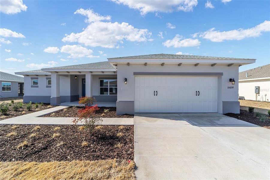 Front exterior of a new home in On Top of the World Communities, Ocala, FL, highlighting curb appeal (Image 19).