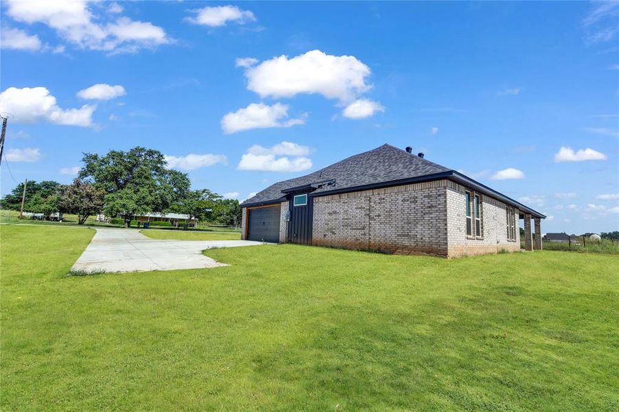 View of yard featuring a garage