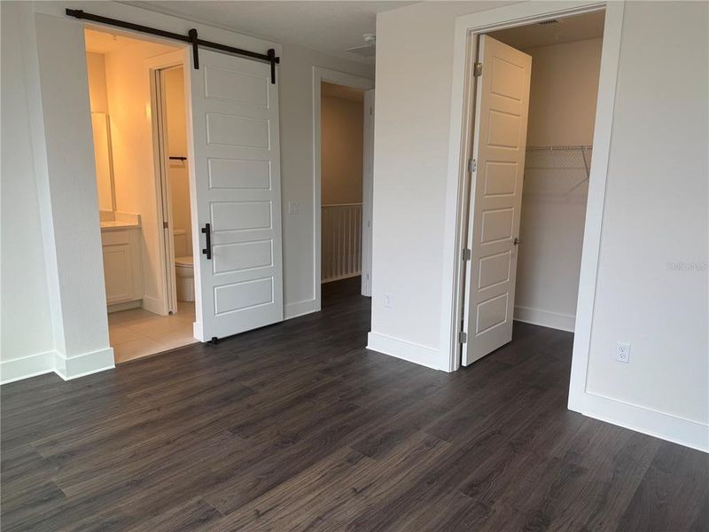 Barn Door Separation of Owner's Suite Bath