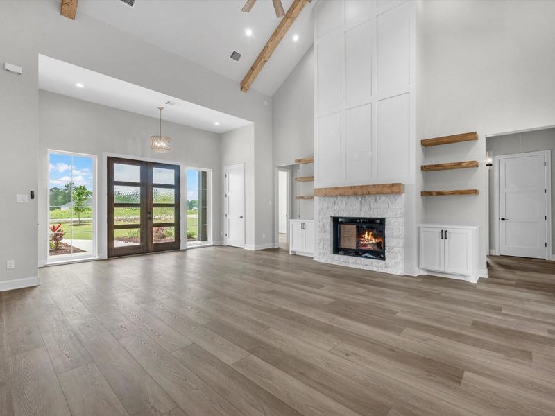 Beautiful gas fireplace with high ceilings.