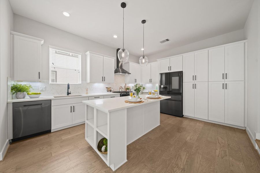 Designed for both style and performance, the island kitchen features upgraded elements including quartz countertops, pendant lights and a breakfast bar perfect for your morning coffee. Designed for both style and performance, the island kitchen features upgraded elements including quartz countertops, pendant lights and a breakfast bar perfect for your morning coffee.