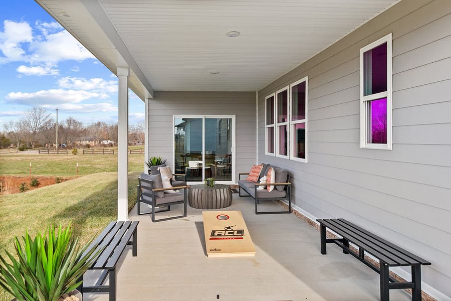 A house with benches and a large window.