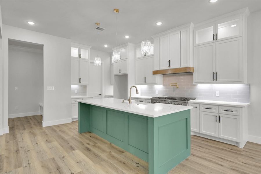 Open-concept kitchen overlooks the living and dining areas for easy flow Open-concept kitchen overlooks the living and dining areas for easy flow