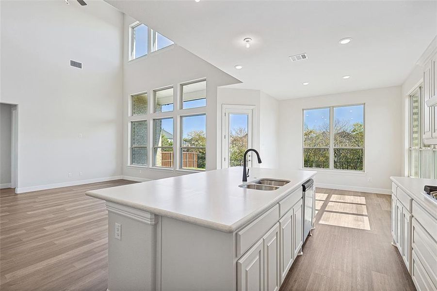 Kitchen featuring a center island with sink, plenty of natural light, and sink