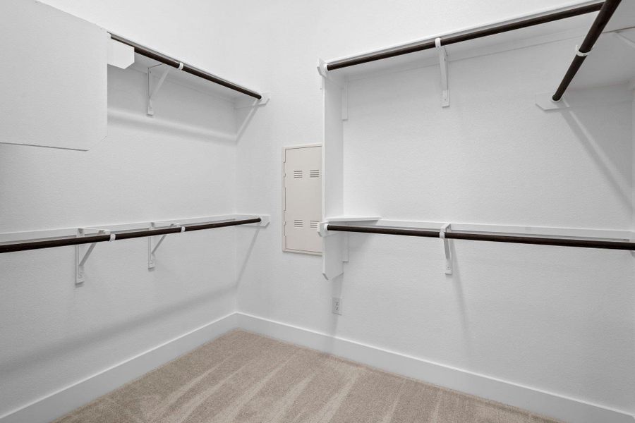Walk-in closet in Primary Bedroom Walk-in closet in Primary Bedroom