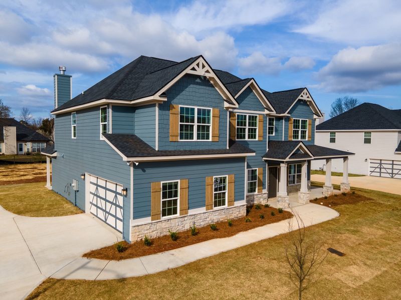 Representative exterior photo of a completed home built from the Cypress by Hughston Homes in Juliette Crossing, Forsyth, GA (Image 22).