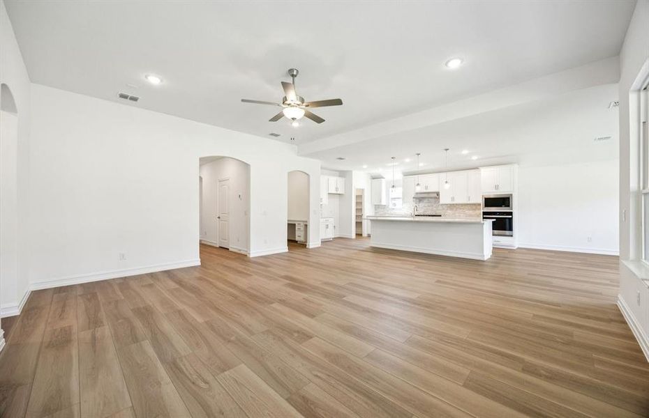 Airy gathering room showcases open concept floorplan