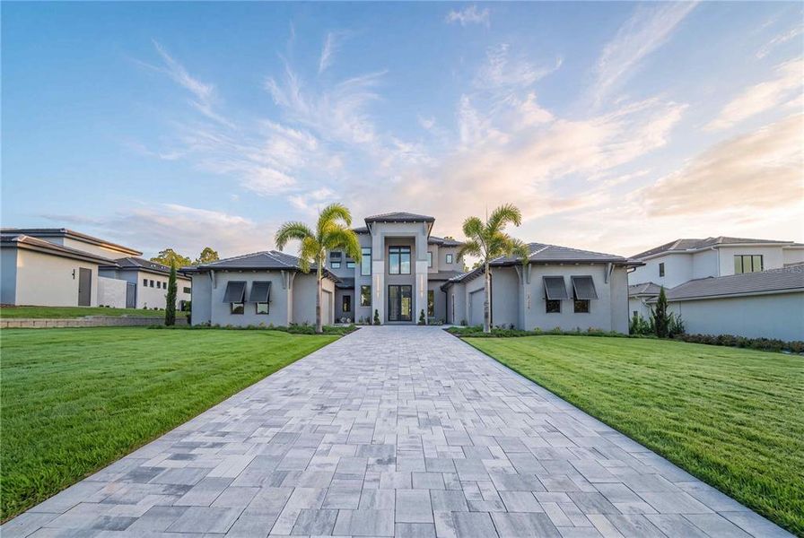Front exterior of a new home in , Montverde, FL, highlighting curb appeal (Image 30). Front exterior of a new home in , Montverde, FL, highlighting curb appeal (Image 30).