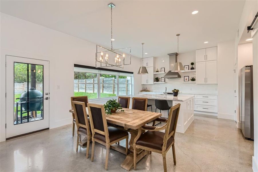 Dining area flows into the beautiful kitchen and easy access to the back patio.