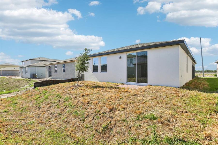 Front exterior of a new home in Villamar - Classic Series, Winter Haven, FL, highlighting curb appeal (Image 21). Front exterior of a new home in Villamar - Classic Series, Winter Haven, FL, highlighting curb appeal (Image 21).