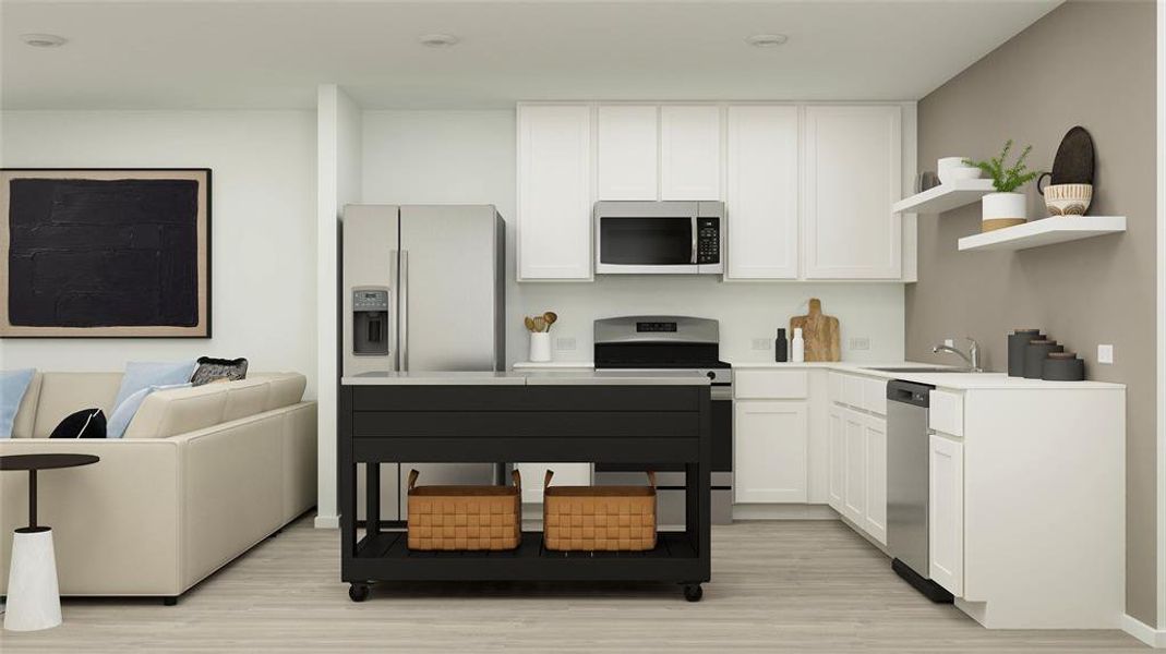 Kitchen featuring white cabinets, sink, light wood-type flooring, and appliances with stainless steel finishes