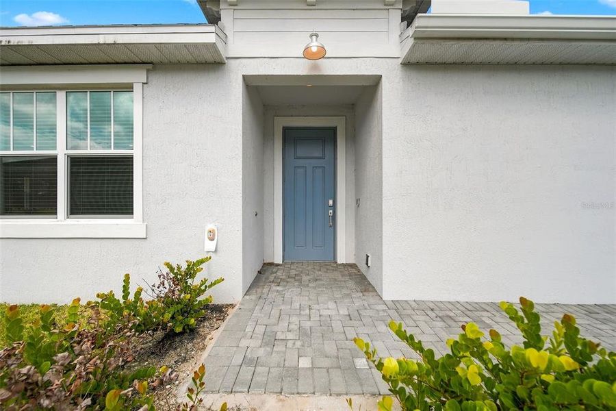 Exterior details and patio area of a home in The Timbers at Everlands, Palm Bay (Image 4).